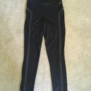 Calvin Klein size M black skinny pants with faux leather accents